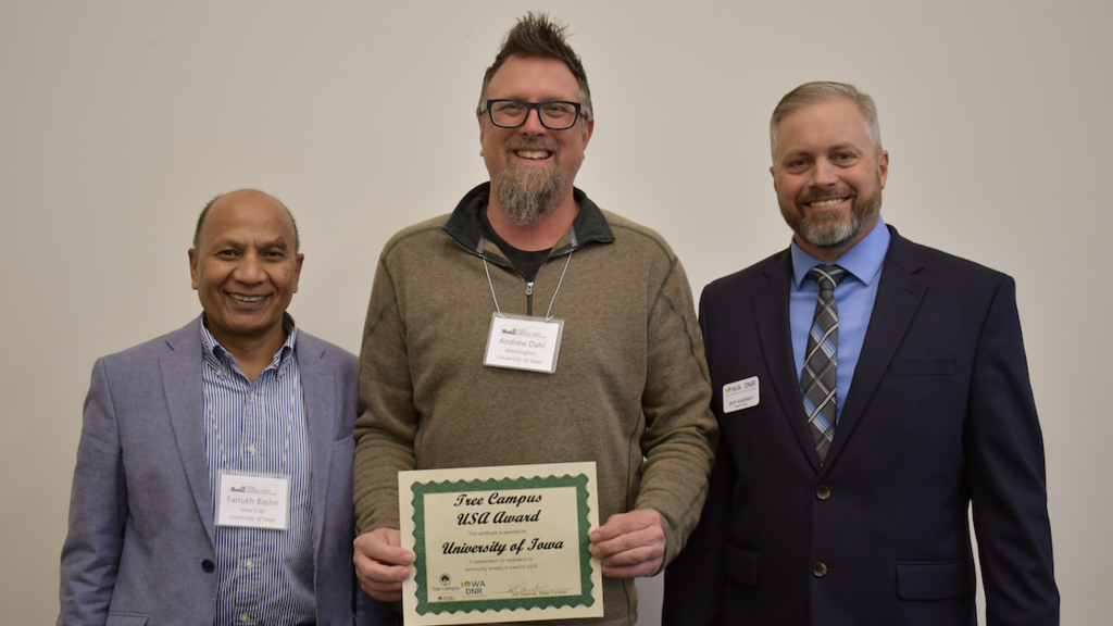Farrukh Bashir and Andy Dahl receive the Tree Campus Higher Education award.